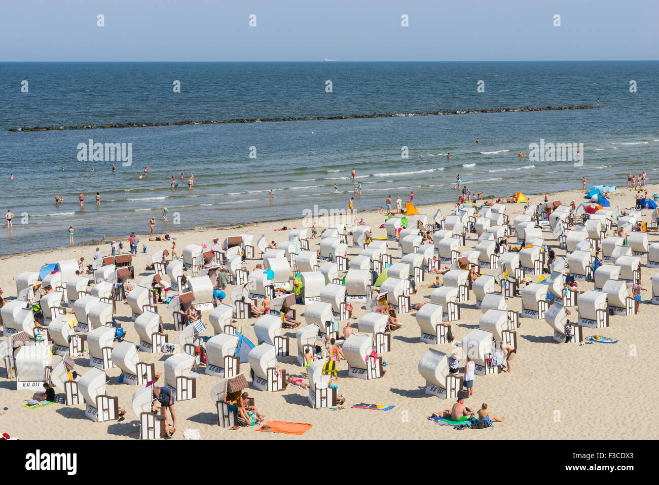 Many traditional Strandkorb beach chairs on beach at Sellin resort on  Rugen Island, Mecklenburg-Vorpommern Germany Stock Photo