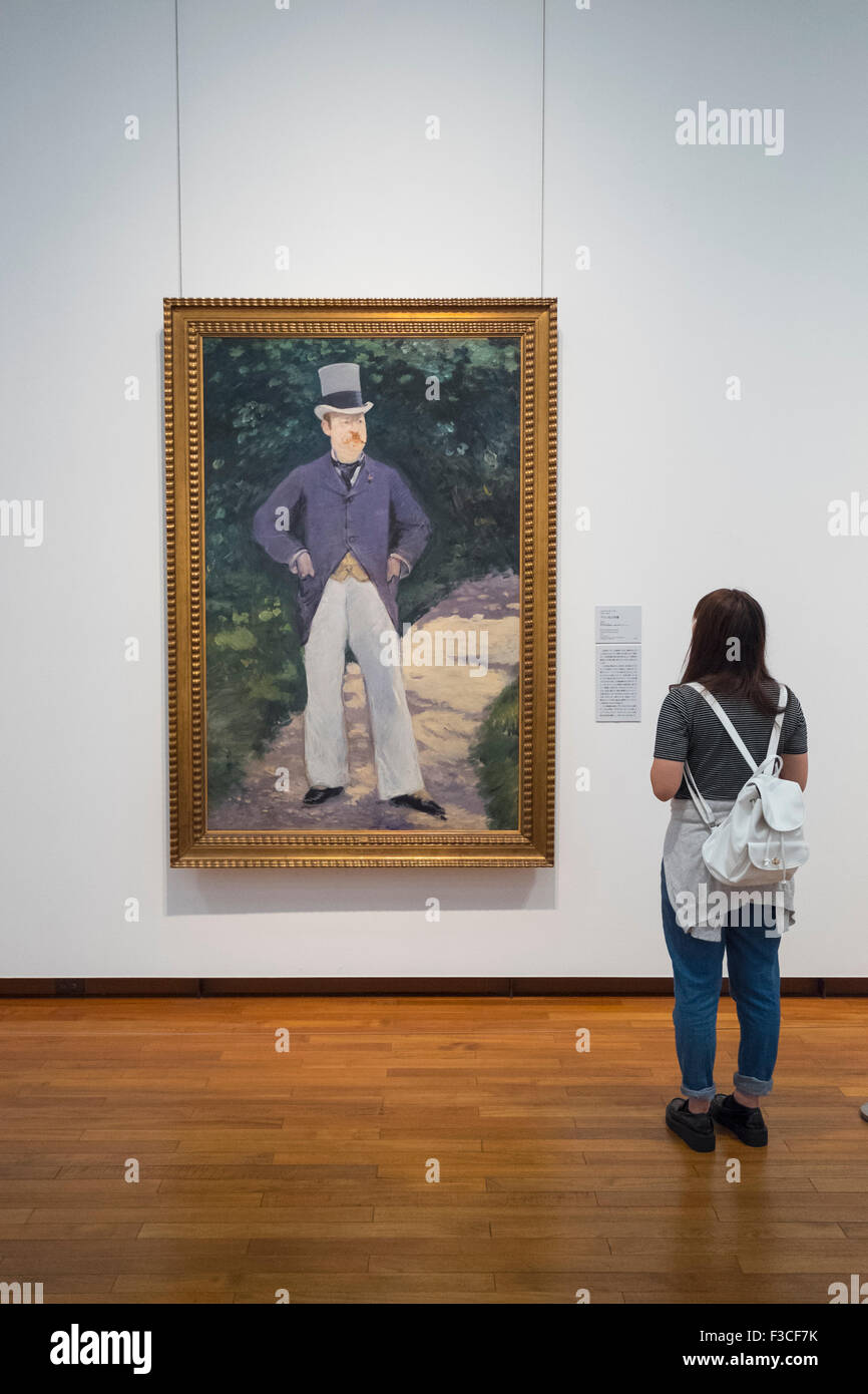 Woman looking at painting Portrait of Monsieur Brun by Edouard Manet at National Museum of  Modern Art  in Tokyo  Japan Stock Photo