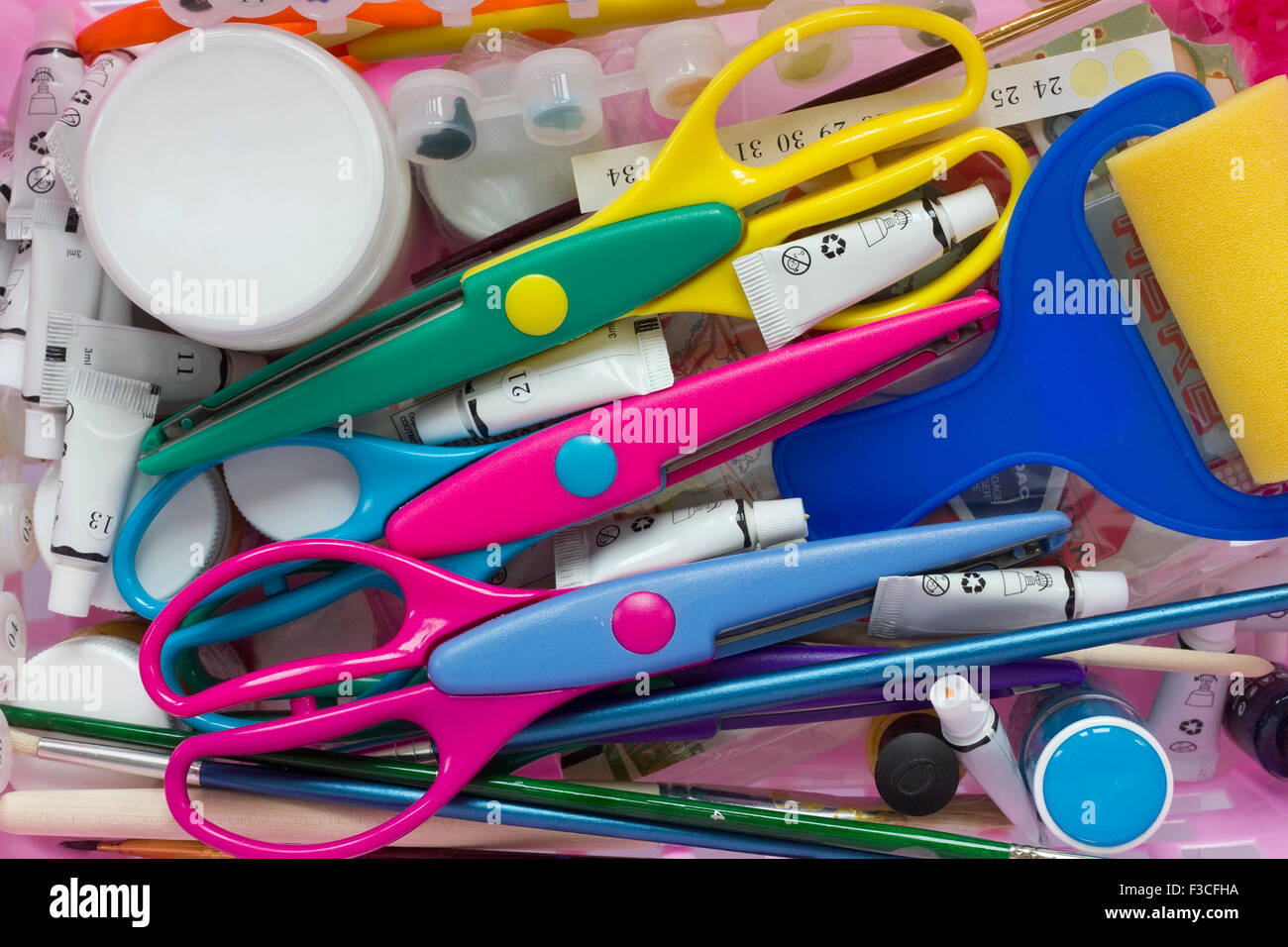 Scrapbooking tools background - scissors, brushes, tubes with paints and so  on Stock Photo - Alamy