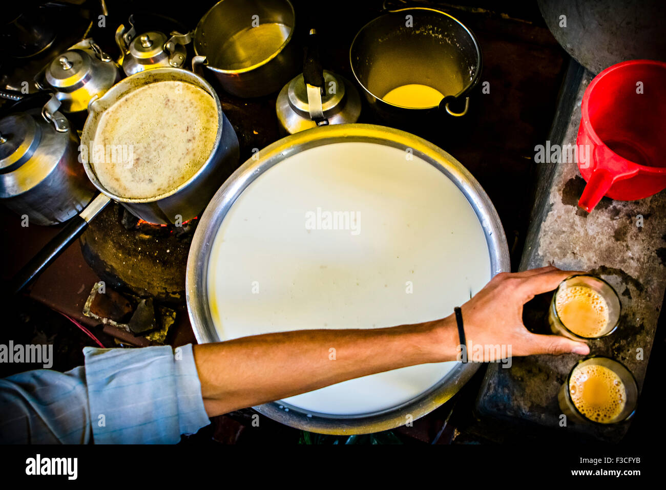 Person cooking on stove, cropped Stock Photo