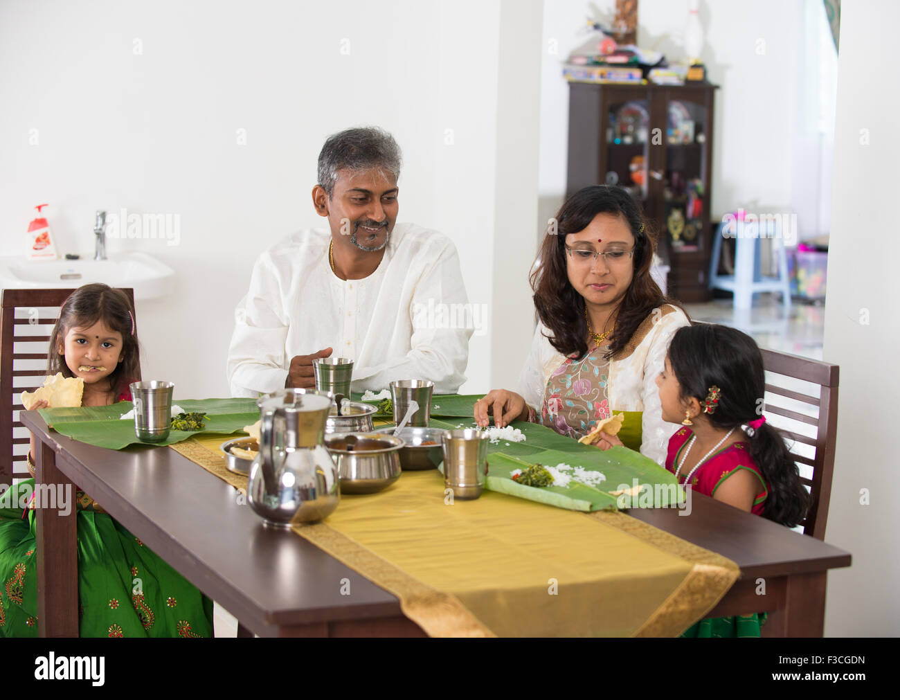 Indian family having dinner hi-res stock photography and images - Alamy