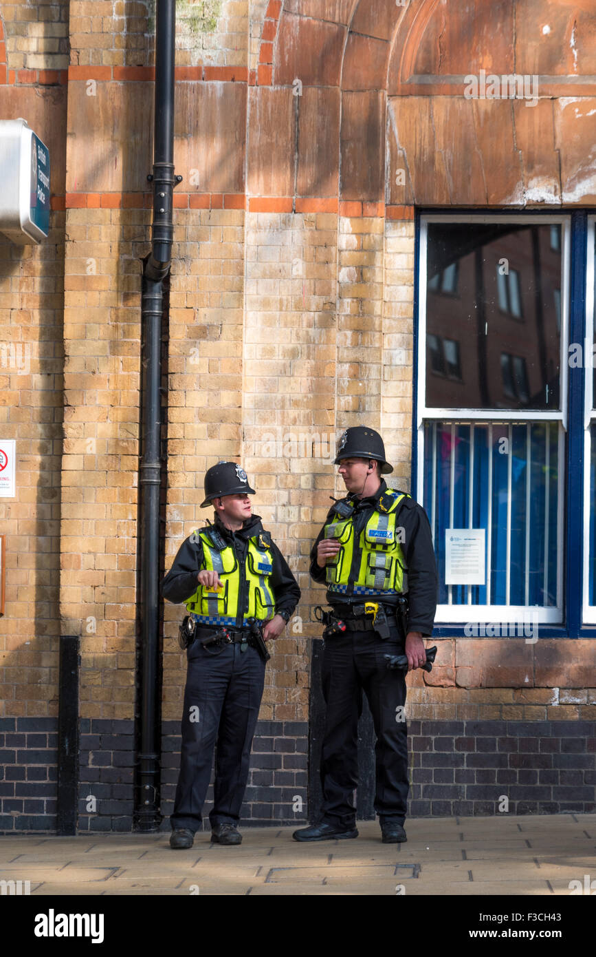 Two transport Police Officers outside the train station in Leicester City, Leicestershire UK Stock Photo