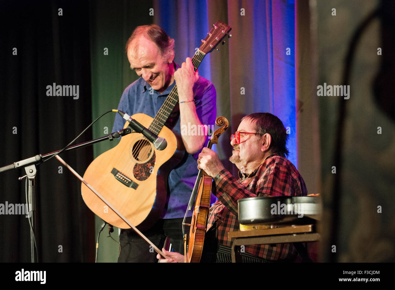 Veteran folk musicians Martin Carthy and Dave Swarbrick in concert at the Victoria Hall, Settle, North Yorkshire, 4th October 2015. Stock Photo