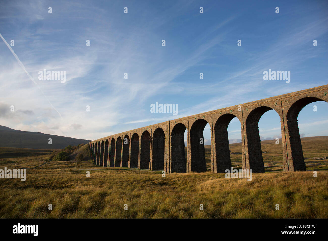 Ribblehead Viaduct or Batty Moss Viaduct carries the Settle-Carlisle Railway across valley of the River Ribble at Ribblehead, in North Yorkshire Dales, England, UK. This impressive Victorian architectural wonder was designed by engineer, John Sydney Crossley and was built between 1870 and 1874. Stock Photo