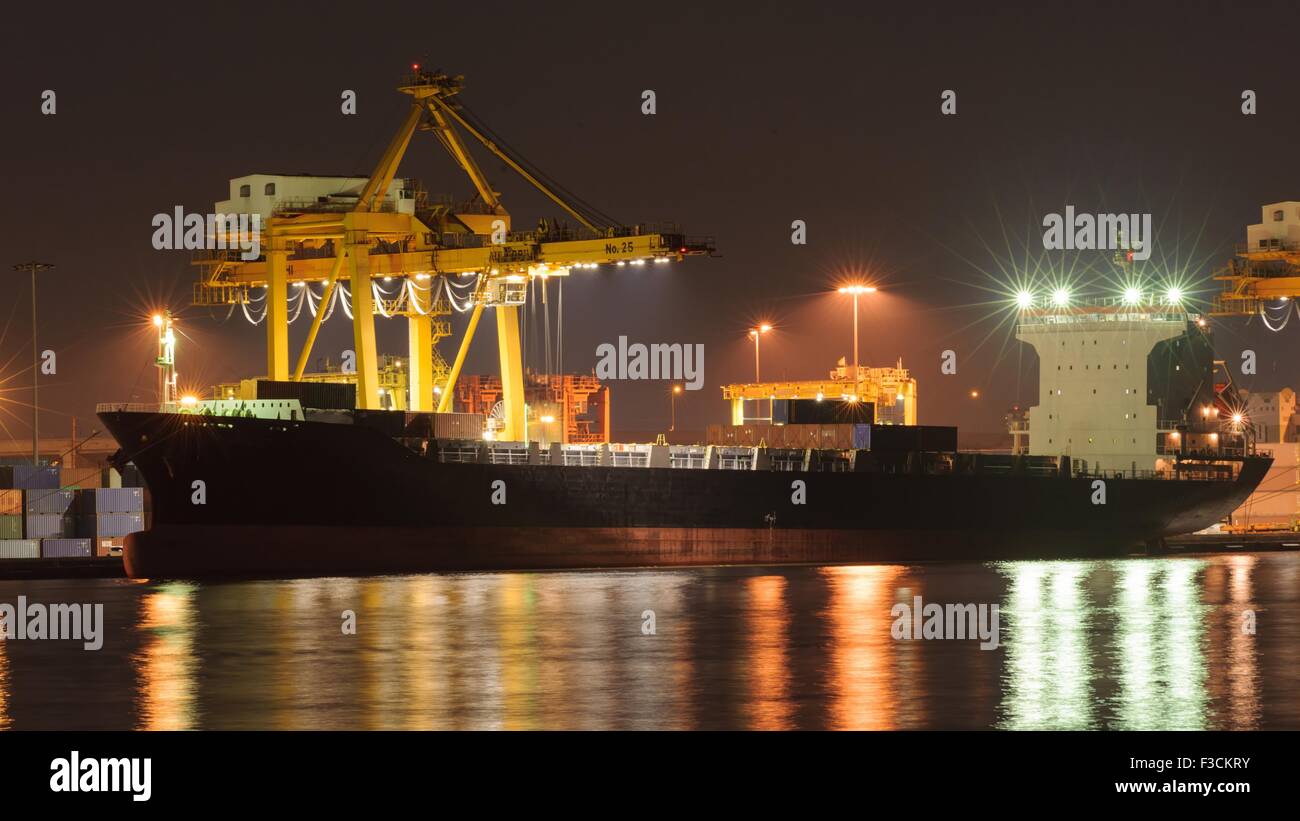 Industrial Container Cargo in shipyard at twilight Stock Photo - Alamy