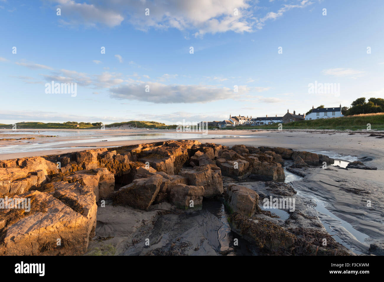 Low Newton, beach and small cluster of houses, Northumberland coast, UK