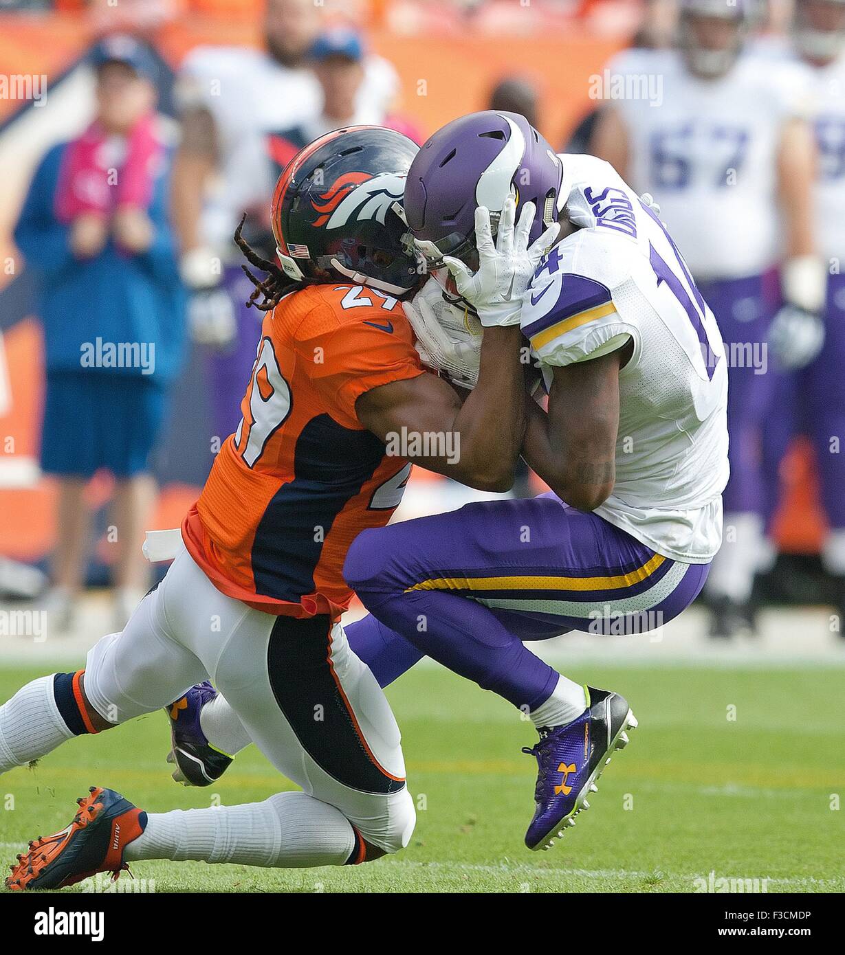 Oct. 4, 2015 - Denver, Colorado, U.S - Vikings WR STEFON DIGGS, right, gets hit head on by Broncos CB BRADLEY ROBY, left, during the 1st. half at Sports Authority Field at Mile High on Sunday afternoon. Broncos beat the Vikings 23-20. (Credit Image: © Hector Acevedo via ZUMA Wire) Stock Photo