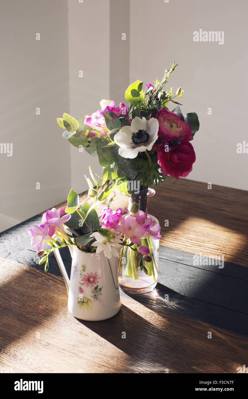 Fresh cut flowers in vases Stock Photo