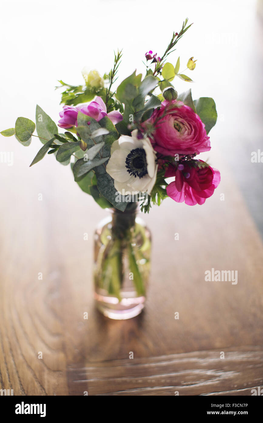 Fresh cut spring flowers in vase Stock Photo