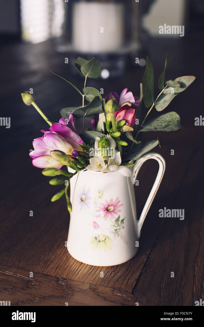 Fresh cut flowers in vase Stock Photo