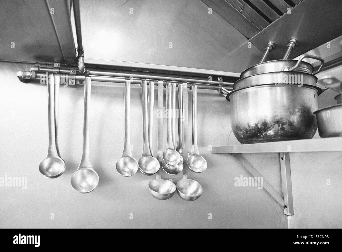 Ladles and pots in commercial kitchen Stock Photo