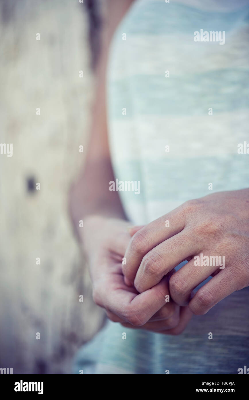 Woman's clasped hands, close-up Stock Photo