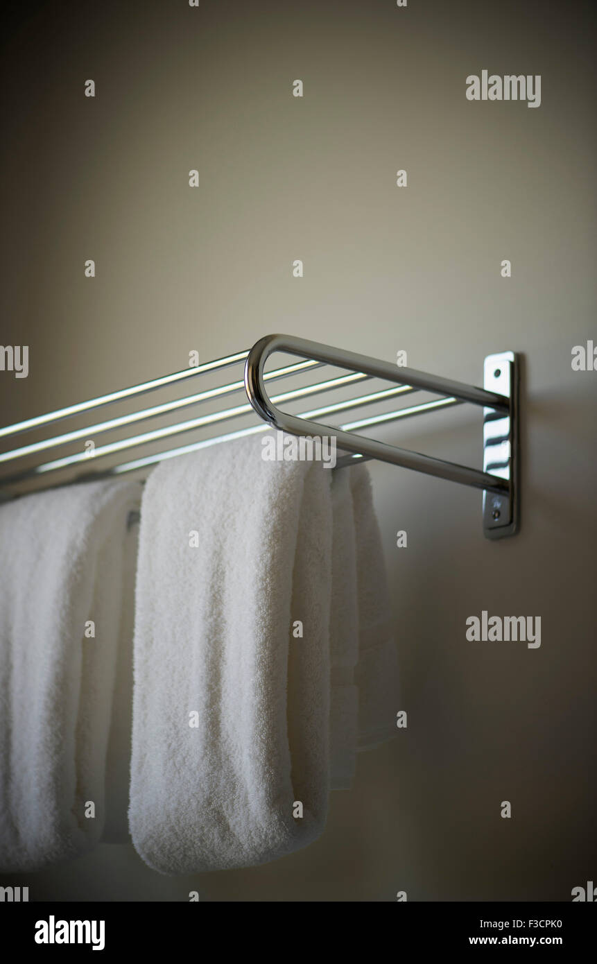 Fresh hand towels hanging from rack Stock Photo Alamy