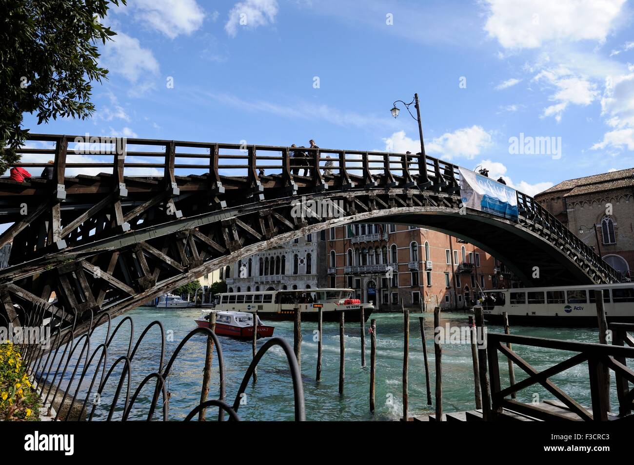 Ponte dell Accademia is made of wood with iron arches, A larger vaporetti was needed to take care of the public tranport, but la Stock Photo
