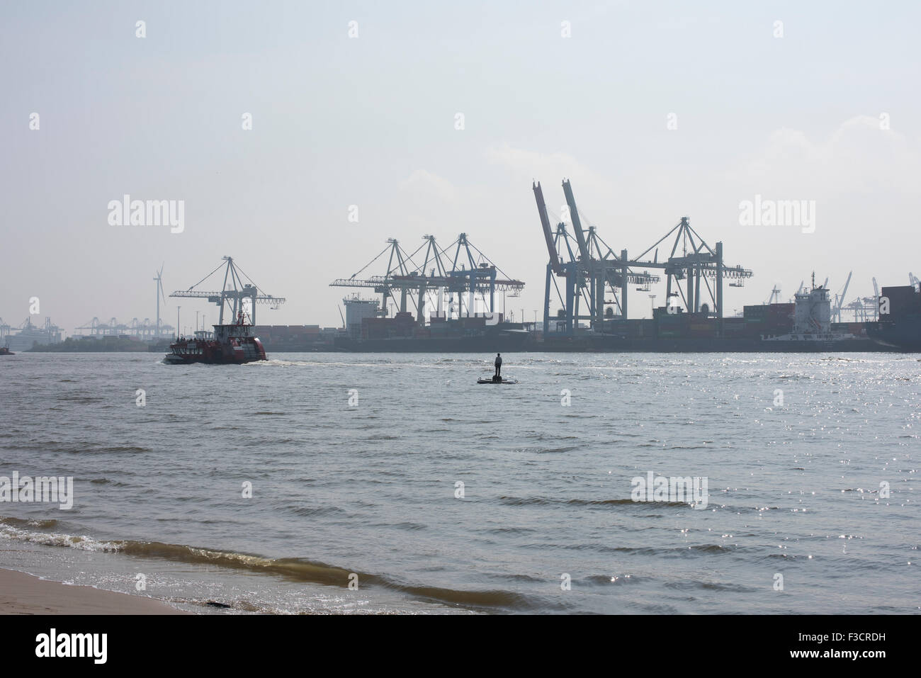The Port of Hamburg showing docks and cranes used for loading and ...