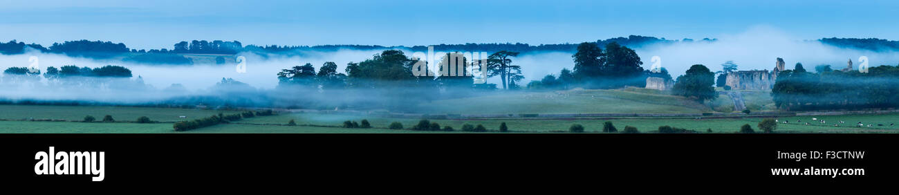 Old Sherborne Castle in the mist at dawn, Dorset, England Stock Photo