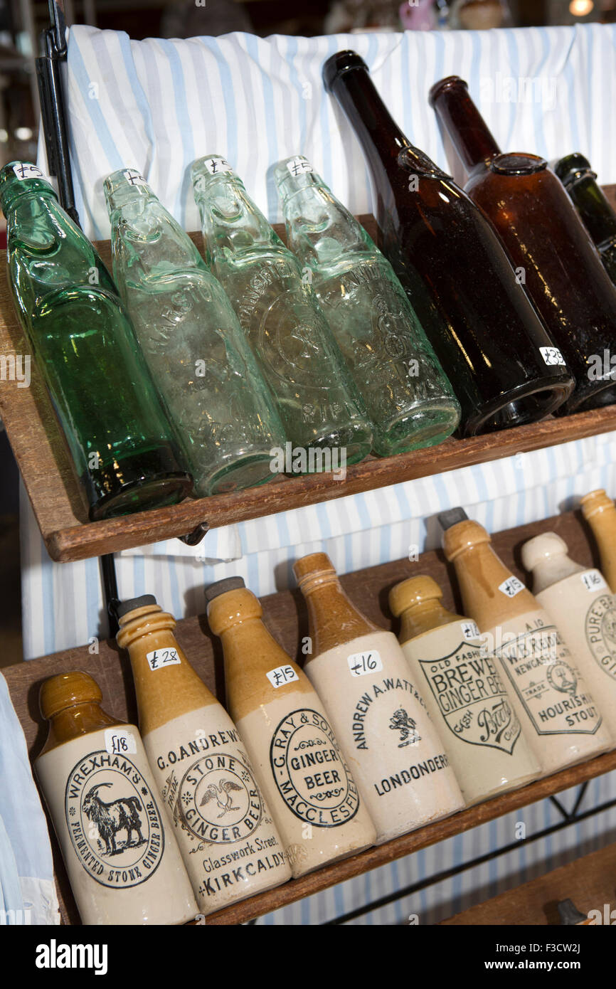 UK, England, Lincolnshire, Lincoln, Antiques Fair Indoor Hall, old stoneware ginger beer and glass pop bottles Stock Photo