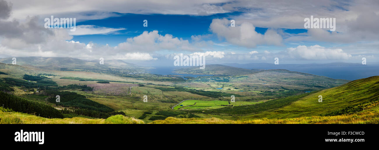 Looking towards Bantry Bay, Bere Island and Castletownbere from Knockoura Mountain, Beara, with Hungry Hill enshrouded in mist Stock Photo