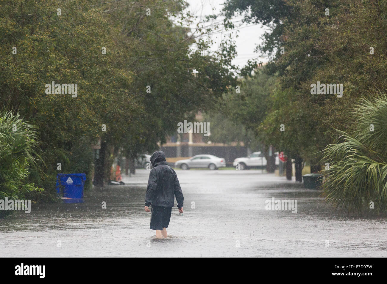 Charleston, South Carolina, USA. 03rd Oct, 2015. Residents walk across a flooded street in the historic district as Hurricane Joaquin brings heavy rain, flooding and strong winds as it passes offshore October 3, 2015 in Charleston, South Carolina. Stock Photo