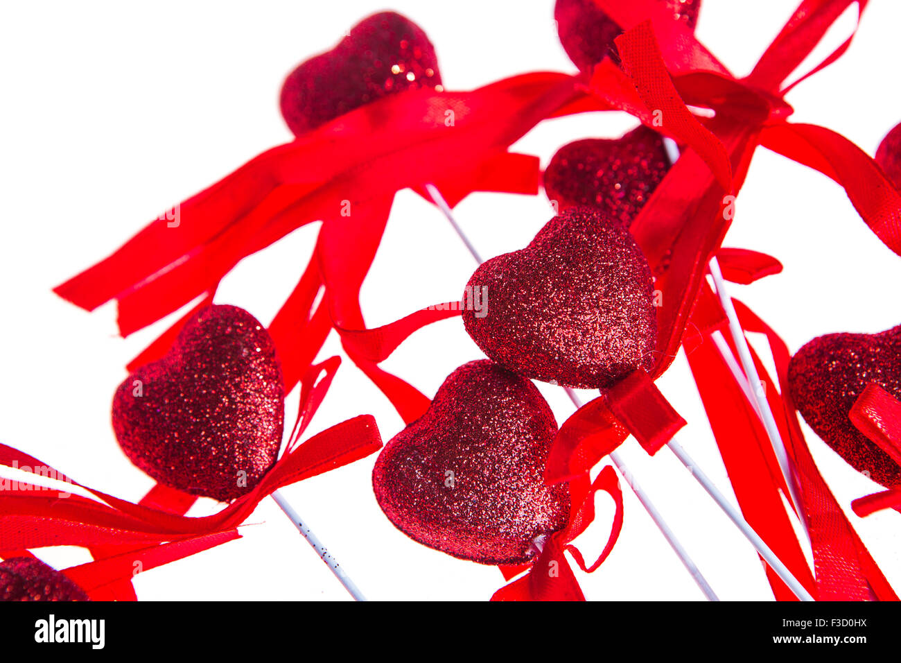 Red valentine heart shaped decorations with ribbon and bows isolated ...