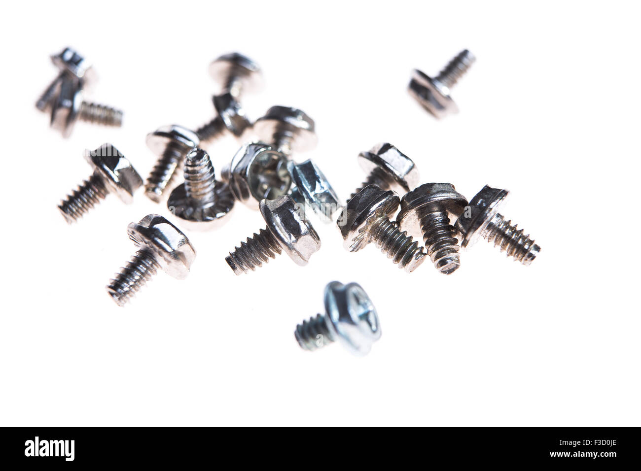 Computer screws against white background Stock Photo - Alamy
