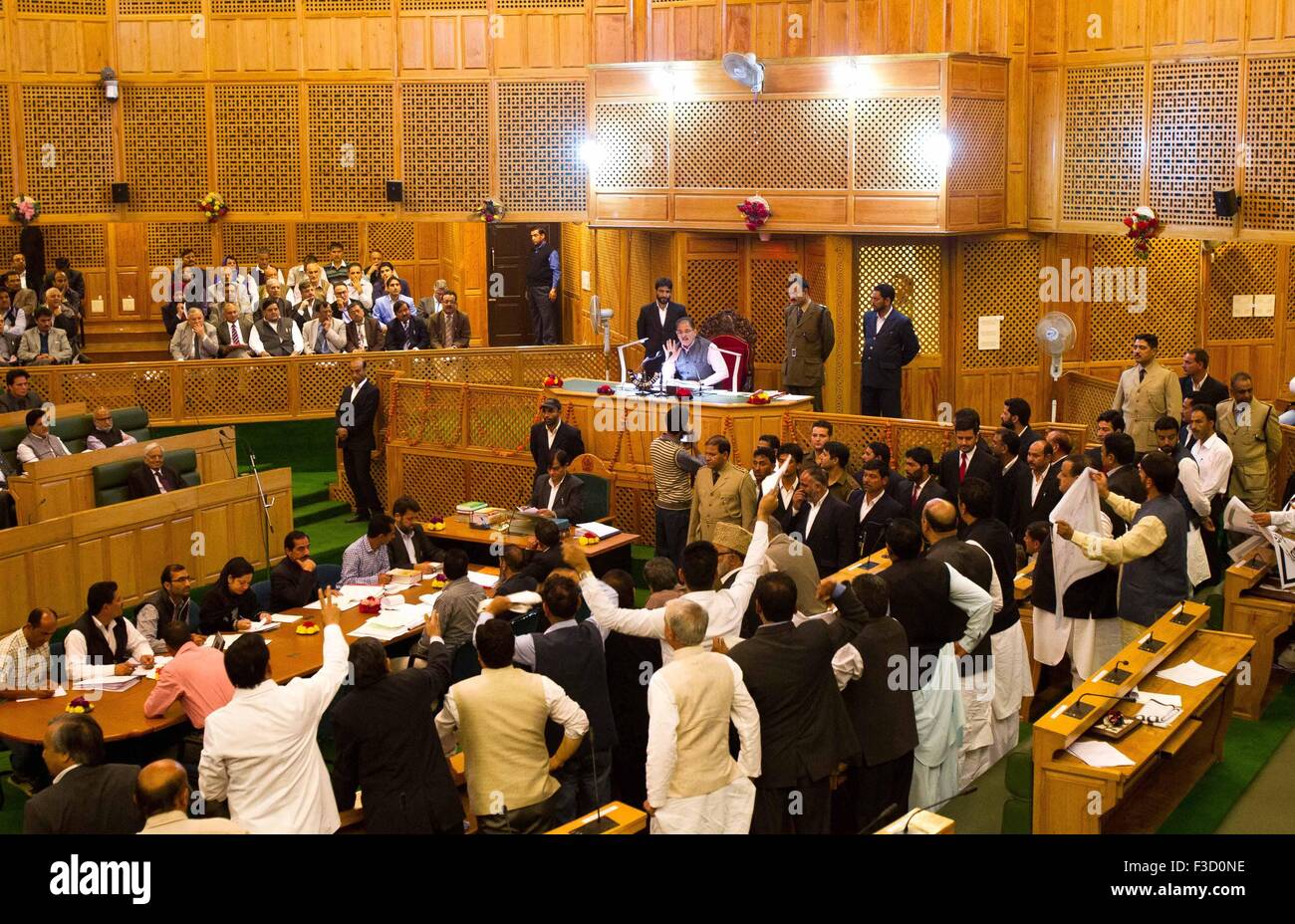 Srinagar, Indian-controlled Kashmir. 5th Oct, 2015. Lawmakers shout slogans at Legislative Assembly in Srinagar, summer capital of Indian-controlled Kashmir, Oct. 5, 2015. The Lawmakers protested against Indian Prime Minister Narendra Modi and Chief Minister of Indian-controlled Kashmir Mufti Muhammad Sayeed on banning slaughter of bovine animals and sale of beef in the region and the failure of the government to provide relief to the 2014 flood victims. Credit:  Javed Dar/Xinhua/Alamy Live News Stock Photo