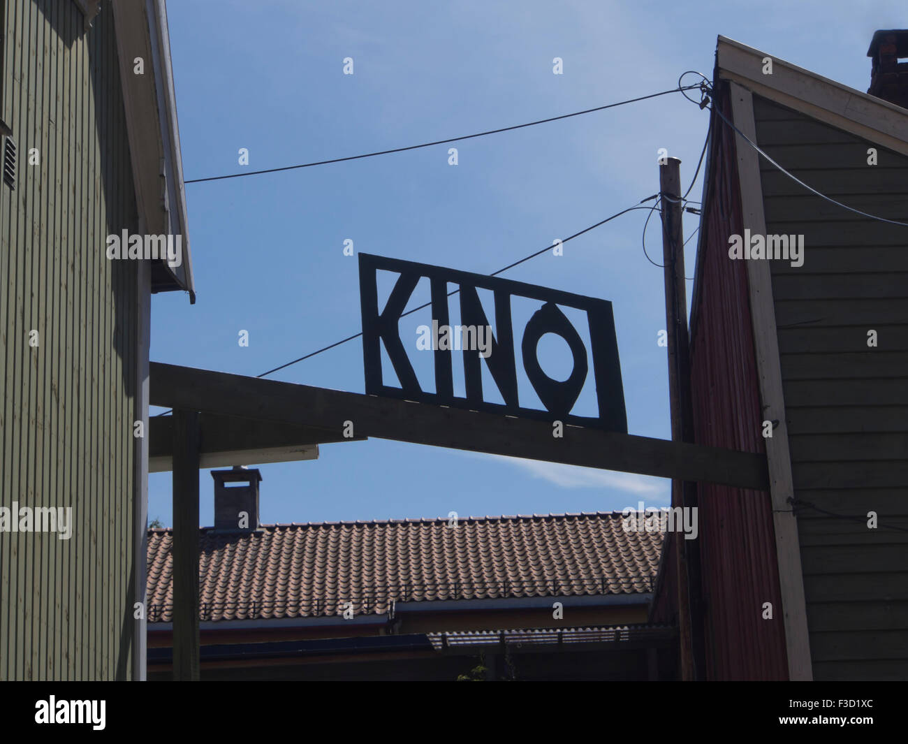The word kino (cinema) in Norwegian, wooden cut out board silhouetted against the blue sky in Gamlebyen Fredrikstad Norwway Stock Photo