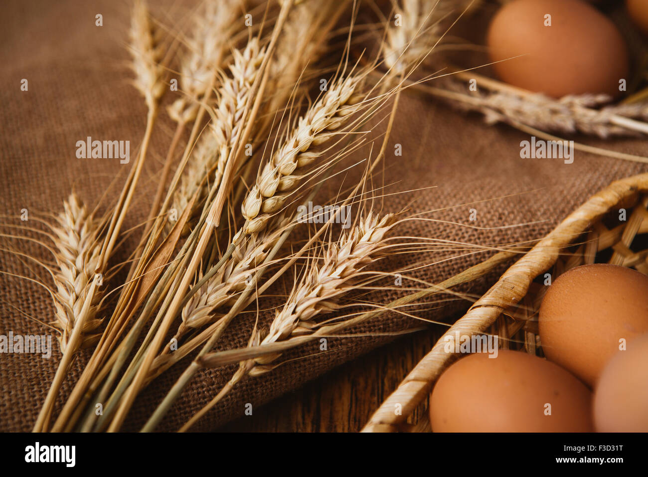 fresh brown eggs and wheat on linen background Stock Photo Alamy