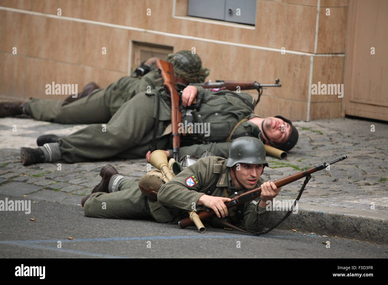 Reenactors uniformed as soldiers of the Russian Liberation Army (ROA) attend the reenactment of the 1945 Prague uprising in Prague, Czech Republic, on May 9, 2015. The Russian Liberation Army also known as the Vlasov Army came to the help of the Czech insurgents to support the Prague uprising against the German occupation which started on May 5, 1945. Stock Photo