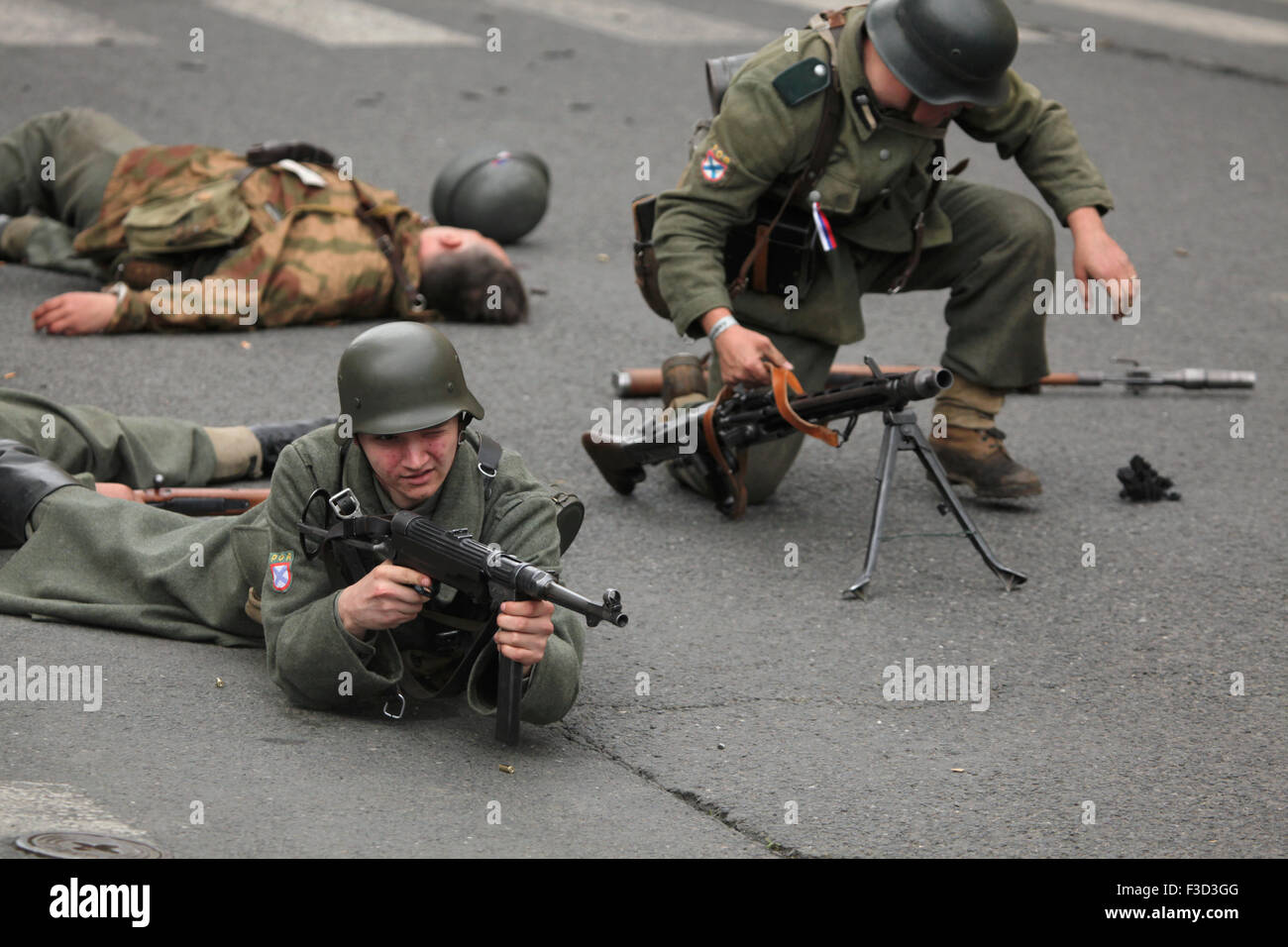 Reenactors uniformed as soldiers of the Russian Liberation Army (ROA) attend the reenactment of the 1945 Prague uprising in Prague, Czech Republic, on May 9, 2015. The Russian Liberation Army also known as the Vlasov Army came to the help of the Czech insurgents to support the Prague uprising against the German occupation which started on May 5, 1945. Stock Photo