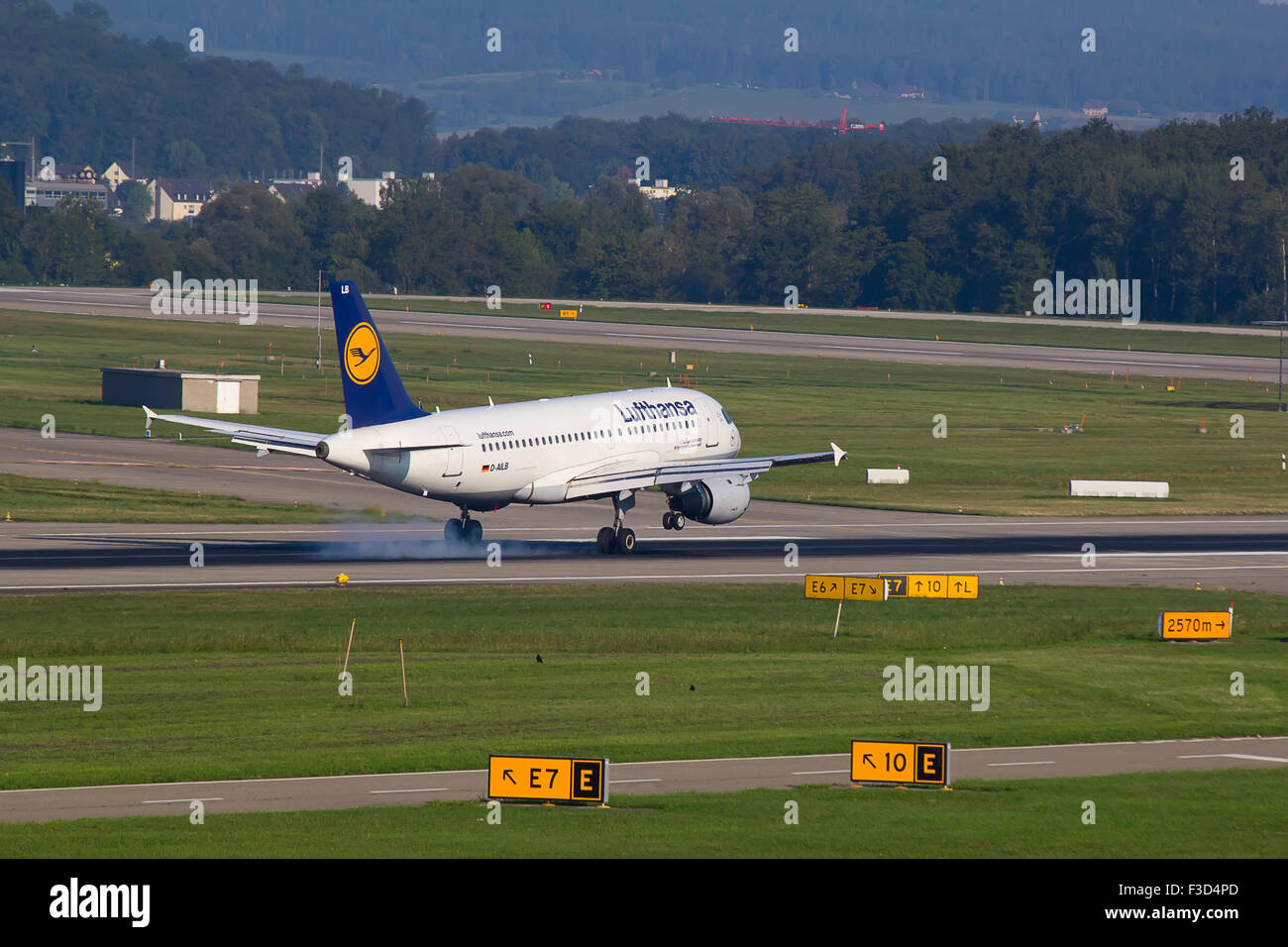 ZURICH - AUGUST 23: A-320 Lufthansa landing in Zurich airport after short haul flight on July 18, 2015 in Zurich, Switzerland. L Stock Photo