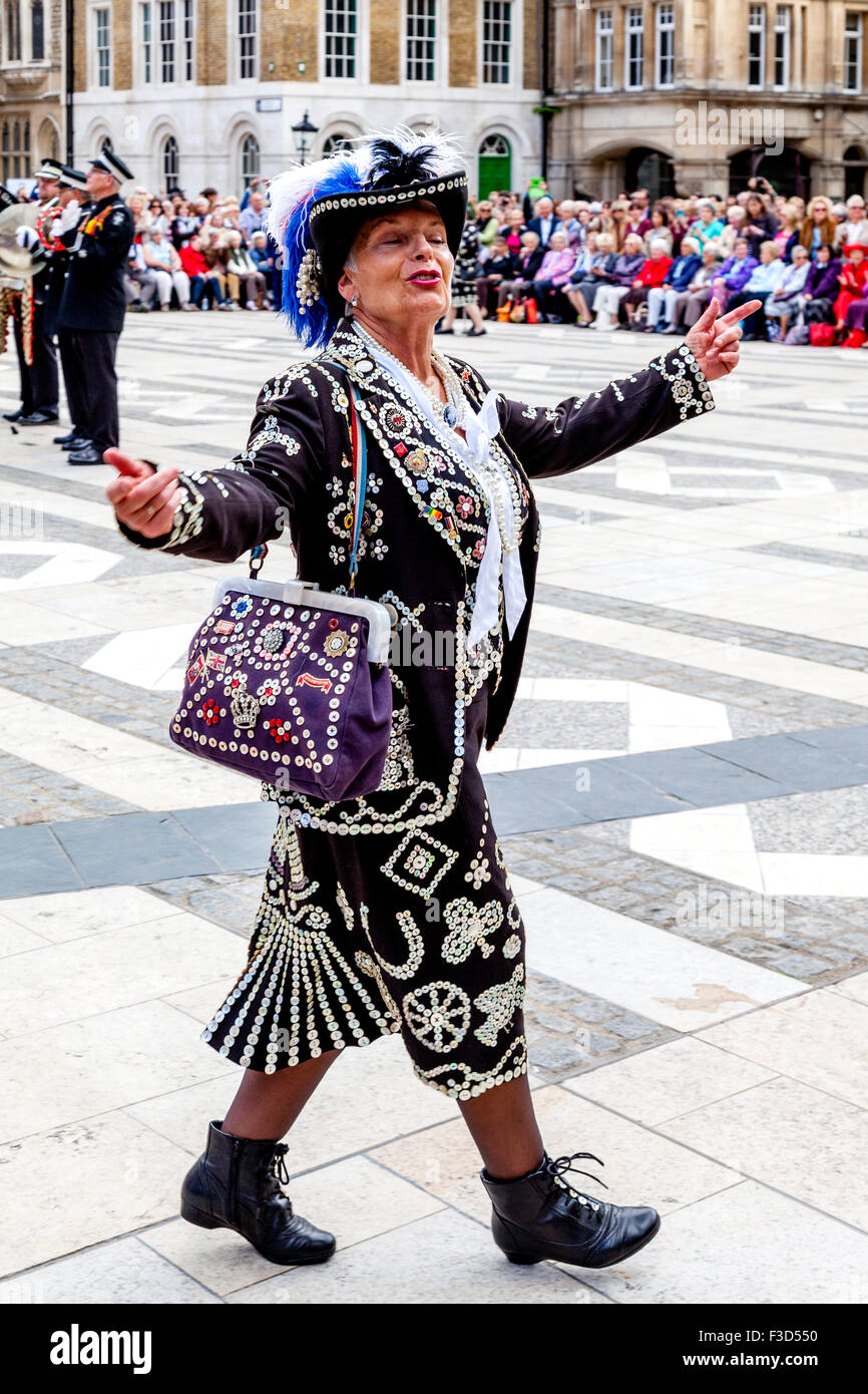 A Pearly Queen Singing At The Annual Pearly Kings and Queens Harvest Festival Held At The Guildhall, London, UK Stock Photo