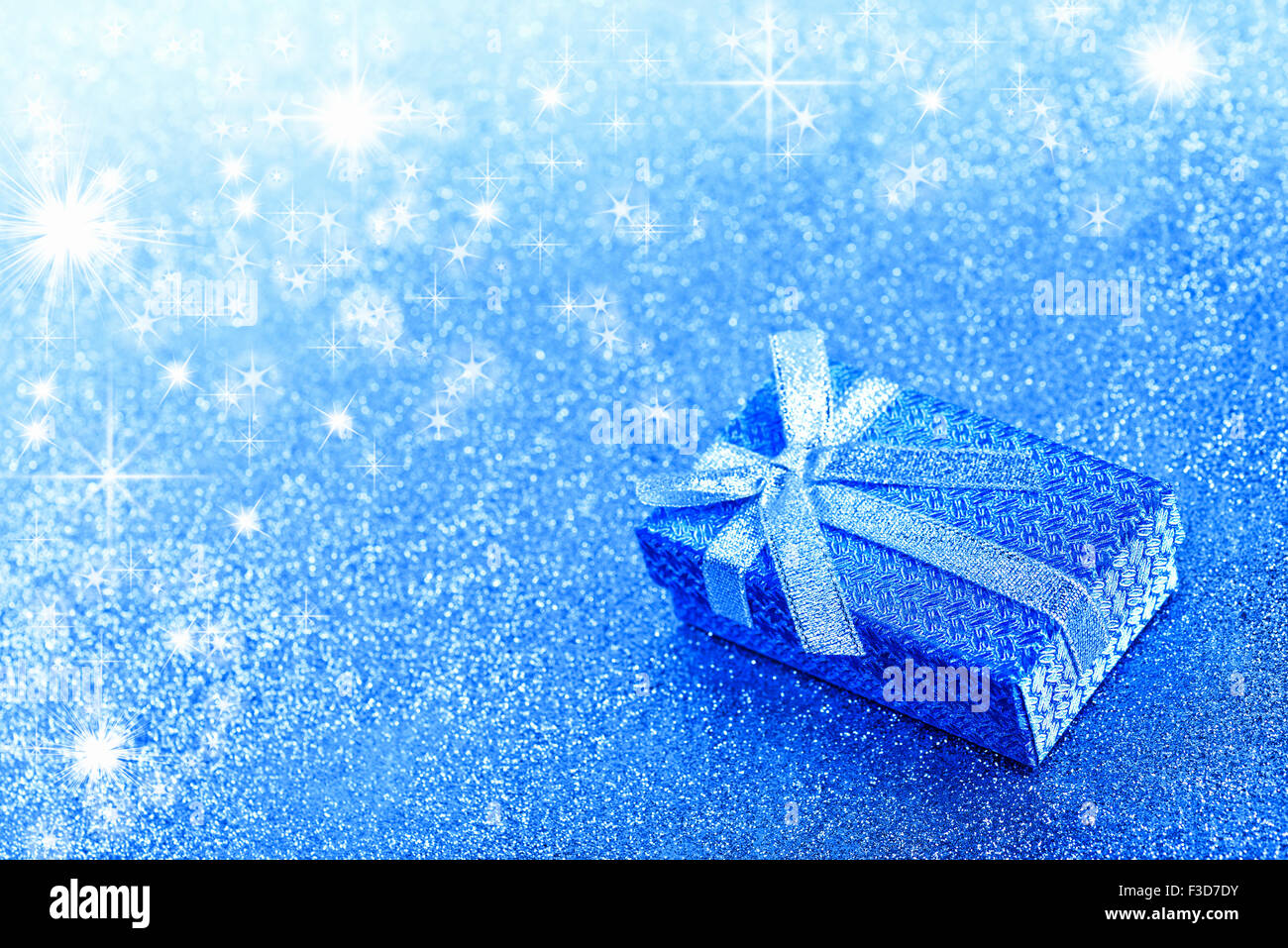Abstract winter blue christmas background with gift box Stock Photo