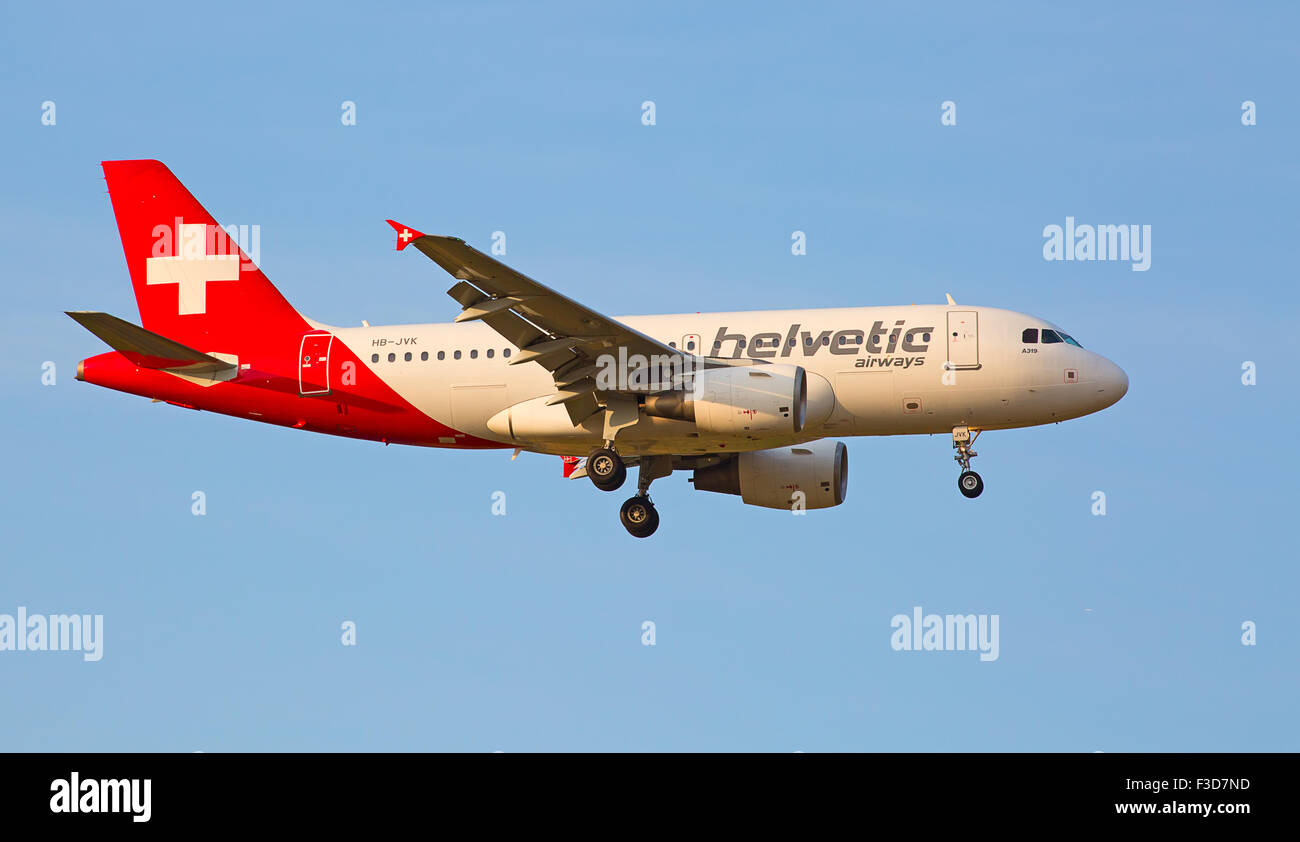 ZURICH - JULY 18: Helvetic airways A-319 landing in Zurich airport after intercontinental flight on July 18, 2015 in Zurich, Swi Stock Photo