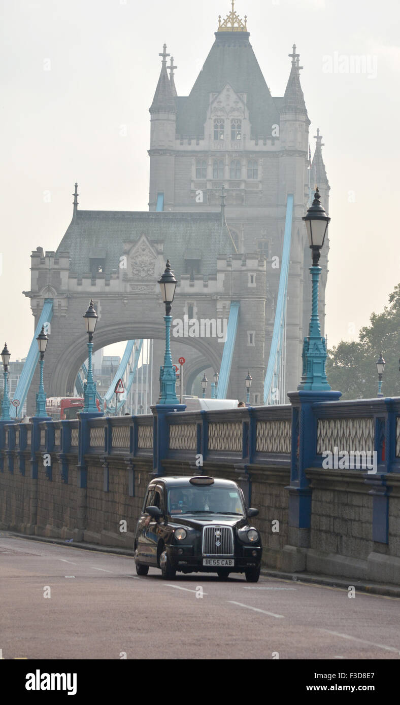 London Black Cab with Tower Bridge background Stock Photo