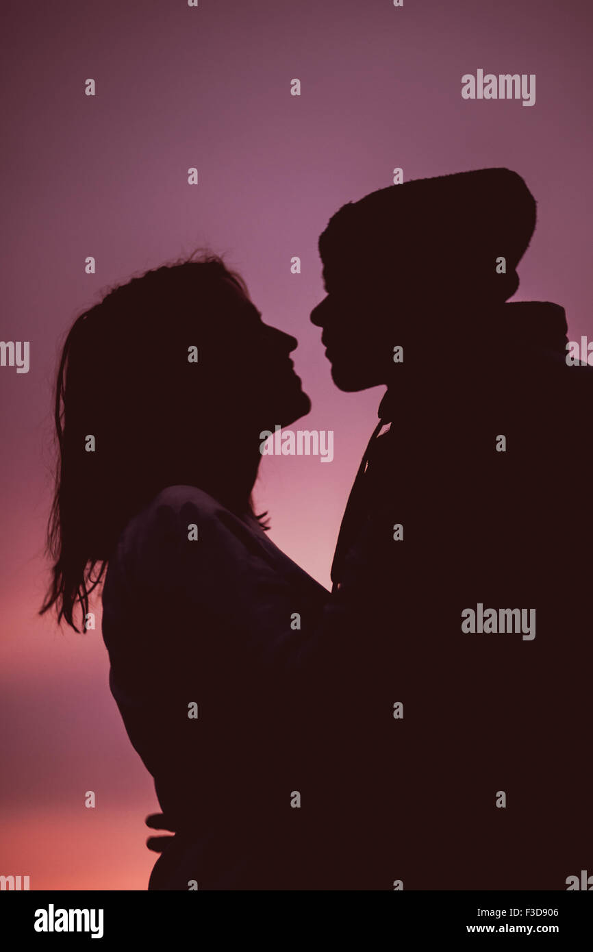 Silhouettes man hugging woman hi-res stock photography and images - Alamy