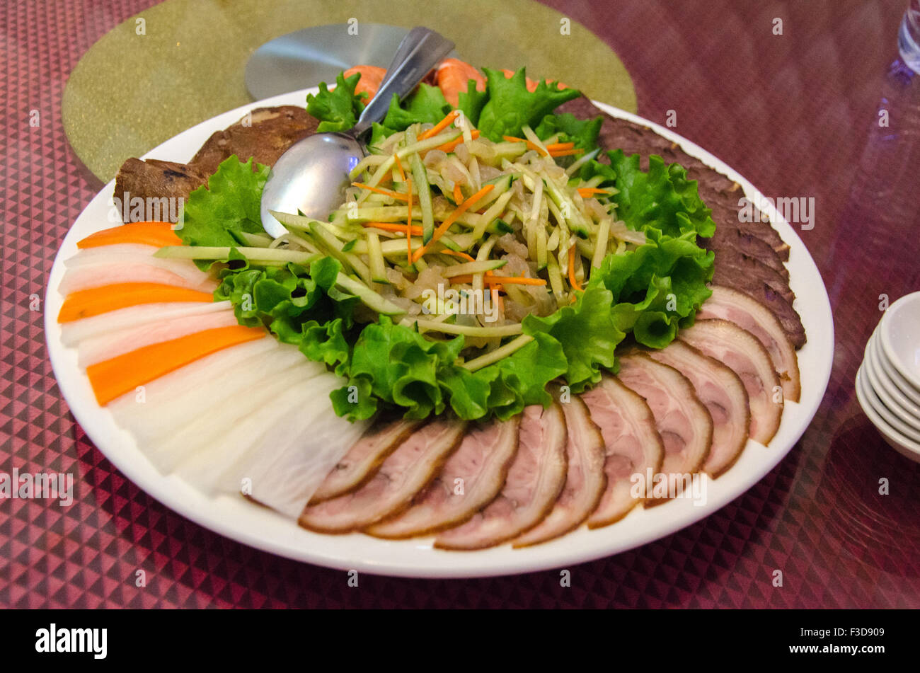 Plate of chinese salad with jellyfish, beef, pork, and vegetables Stock Photo