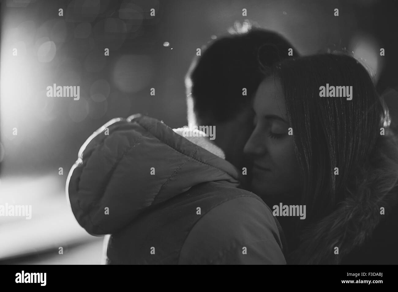 Close-up image of couple in love, man  kisses a woman. Used filters instagram Black-white photo. Stock Photo
