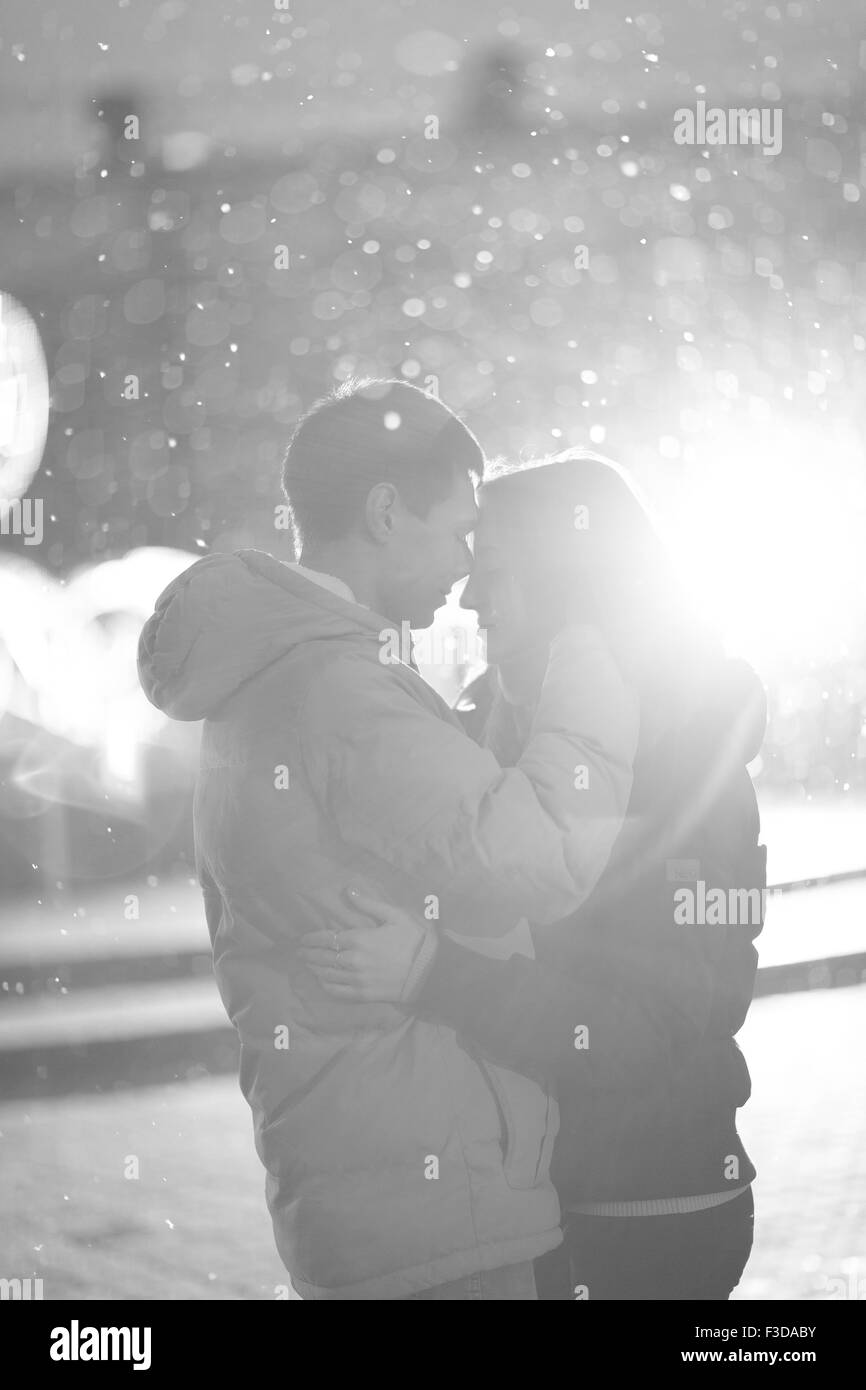 Close-up image of couple in love, man  kisses a woman. Used filters instagram Black-white photo. Stock Photo