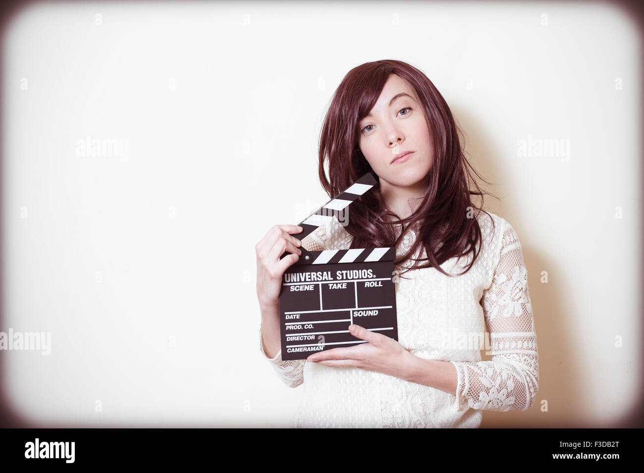 Young beautiful cinema actress with movie clapper board portrait Stock Photo