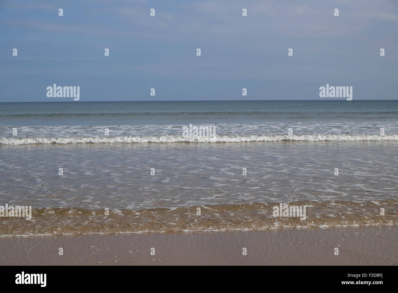 View sand beach sea waves hi-res stock photography and images - Alamy