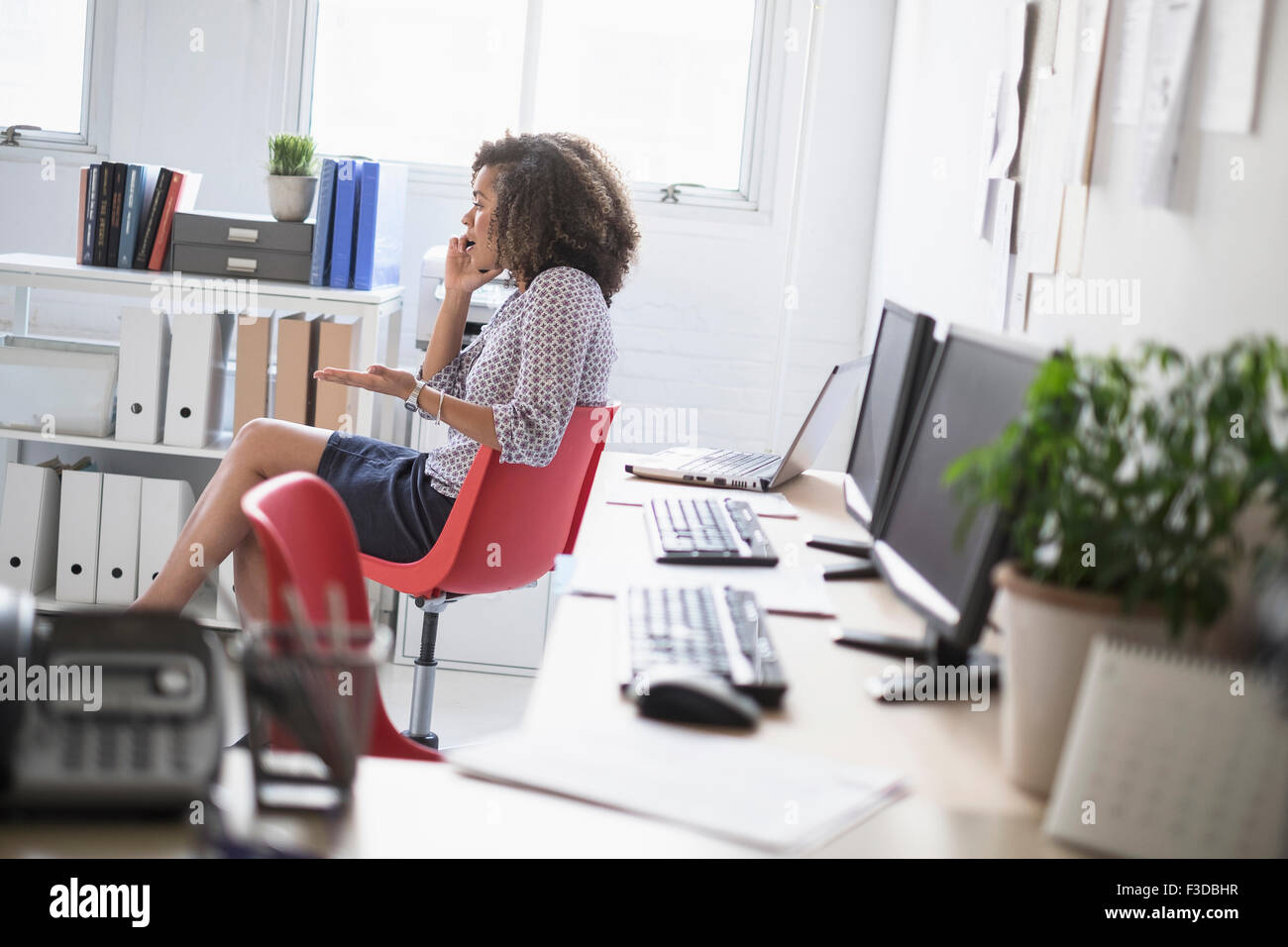 Young woman working at office Stock Photo