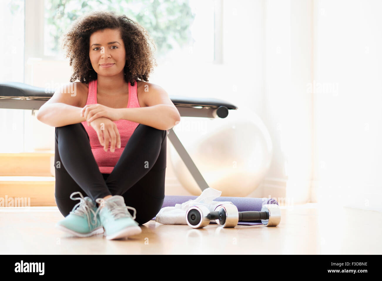 Portrait of young woman at gym Stock Photo - Alamy
