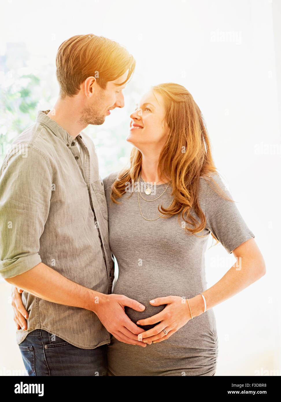 Mid-adult couple face to face outdoors Stock Photo