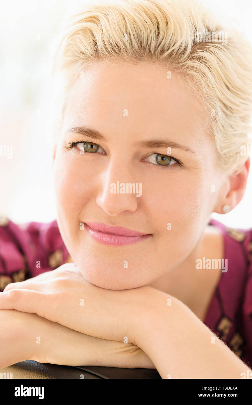 Portrait of young woman indoors Stock Photo