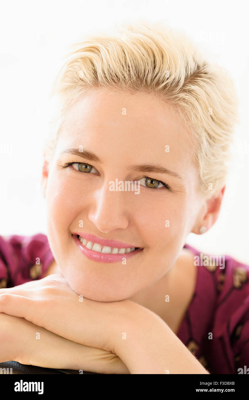 Portrait of young woman indoors Stock Photo