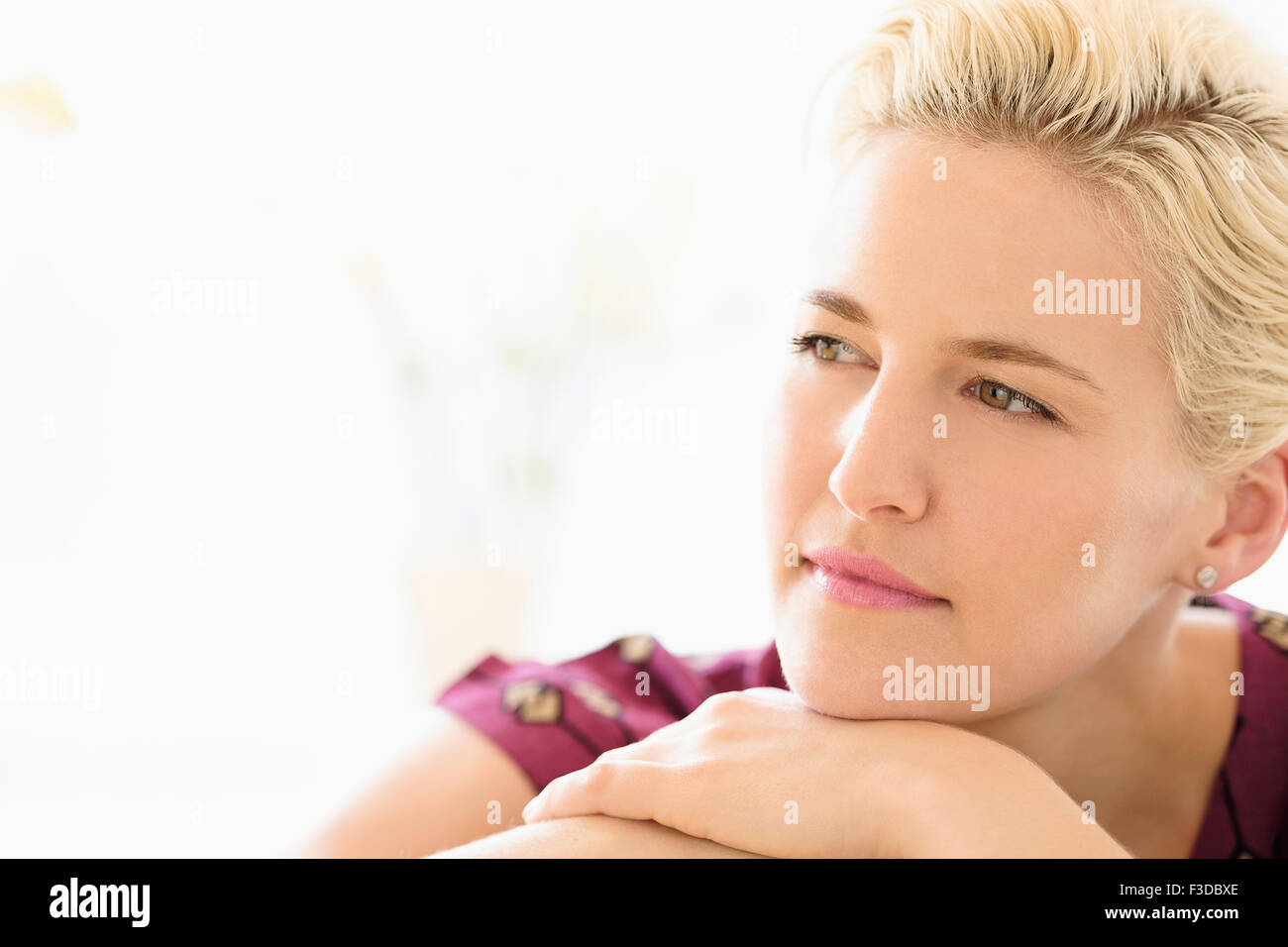 Portrait of young woman indoors Stock Photo