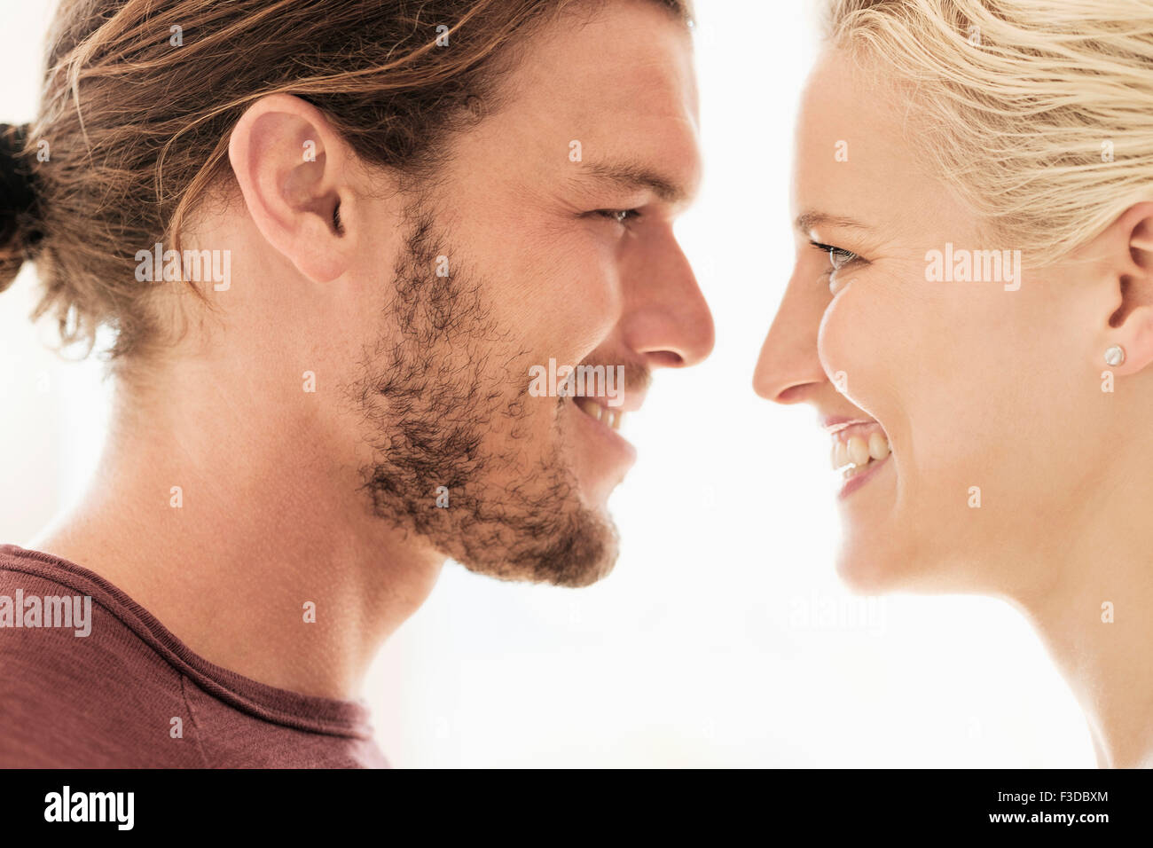 Couple face to face on white background Stock Photo