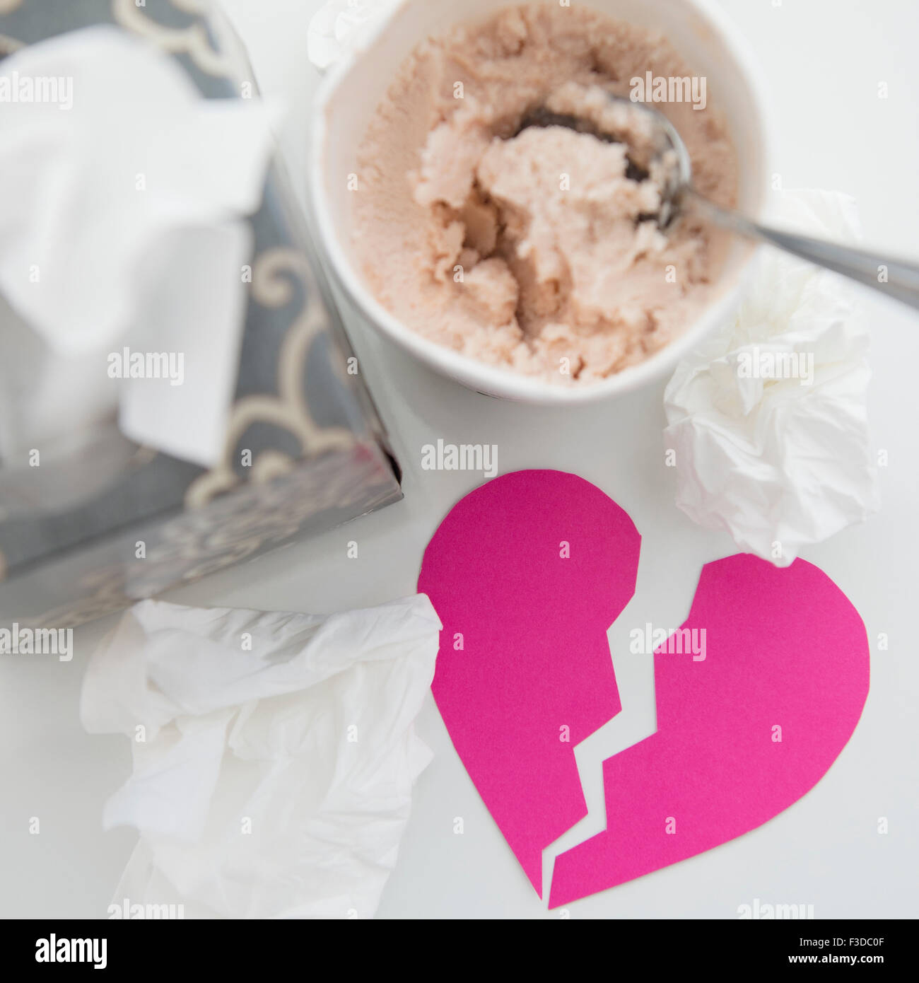 Wet facial tissues and ice cream on table Stock Photo