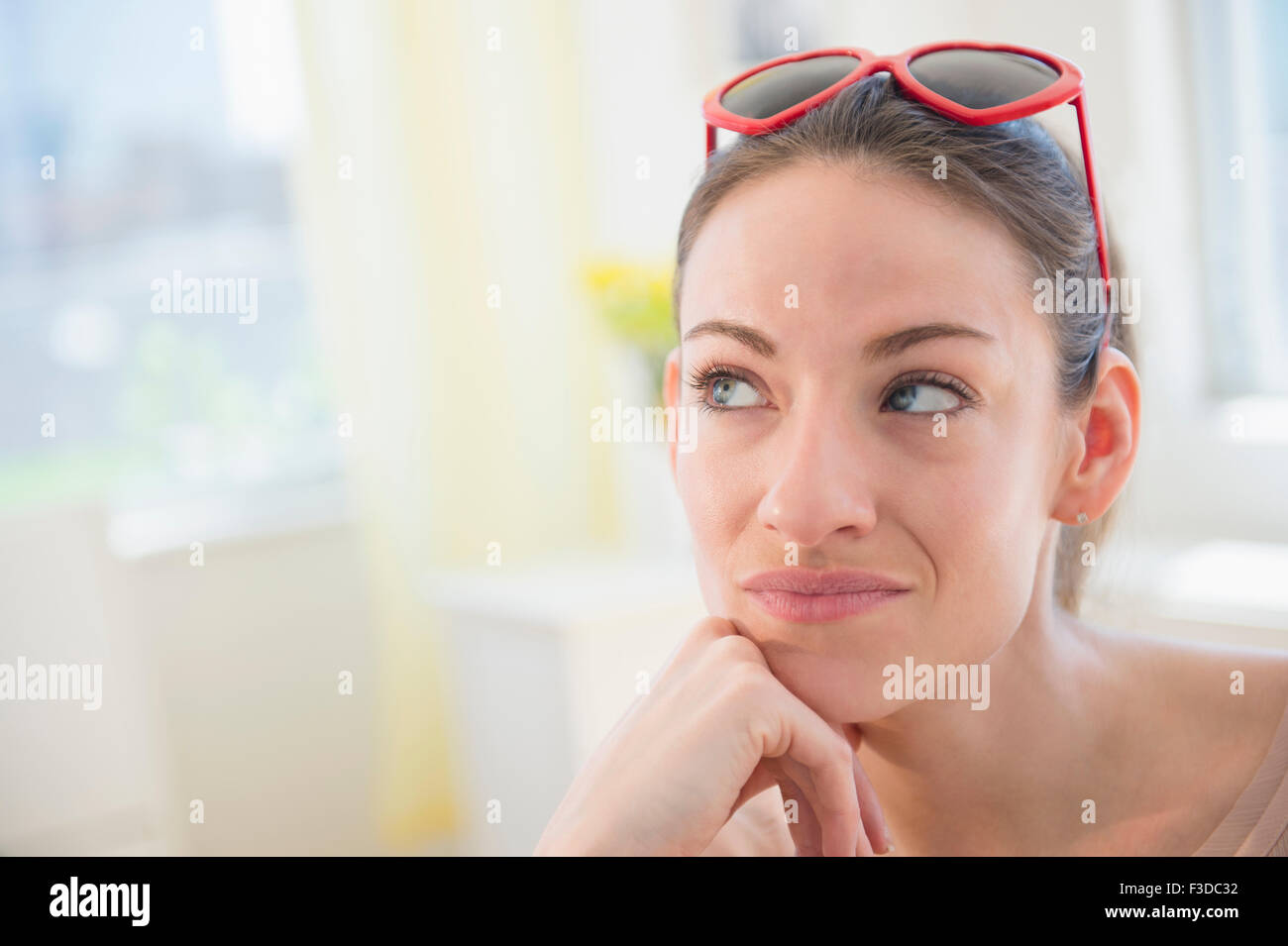 Woman at home contemplating Stock Photo